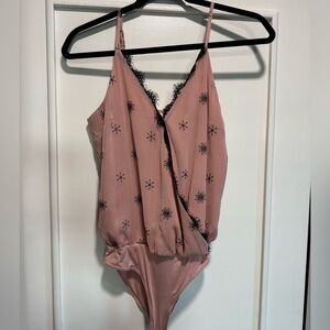 Blush and black bodysuit